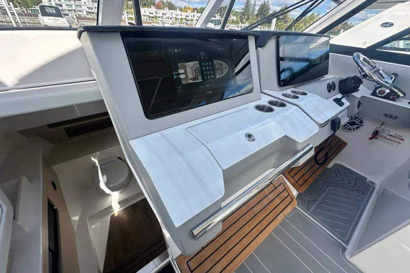 Slide: The Image of 2025 Regal LX36 boat cockpit with modern controls and sleek design. - 29