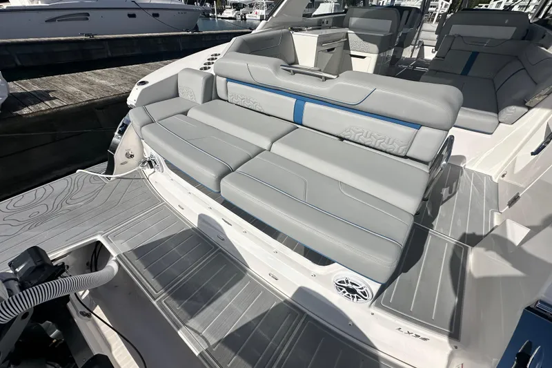 Slide: The Image of 2025 Regal LX36 boat interior with luxurious gray seating and modern design. - 31
