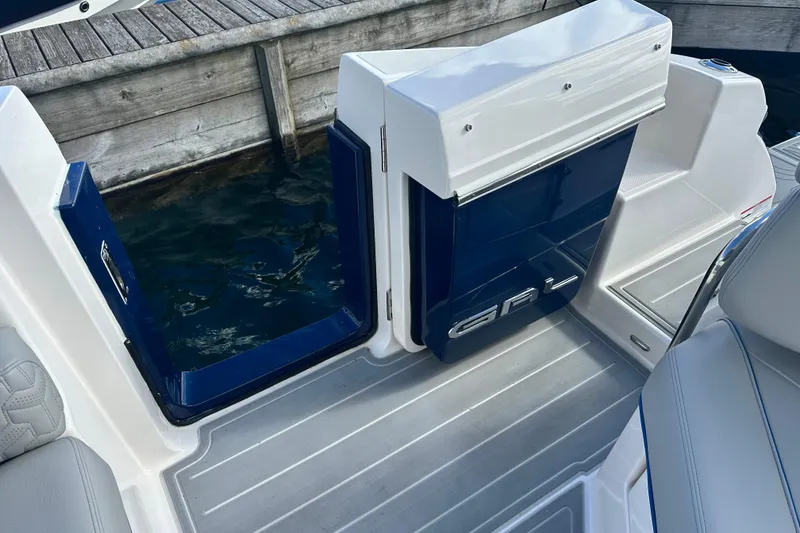 Slide: The Image of 2025 Regal LX36 boat interior with open door, dockside view. - 33