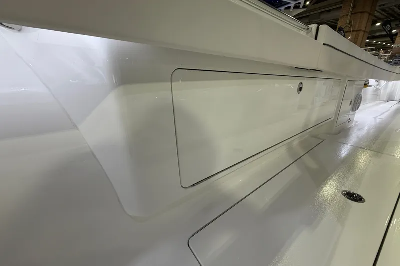 Slide: The Image of 2026 Valhalla Boatworks V-33 sleek white deck detail in showroom lighting. - 12