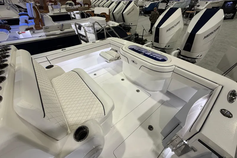 Slide: The Image of 2026 Valhalla Boatworks V-33 with luxurious seating and powerful Mercury engines. - 14
