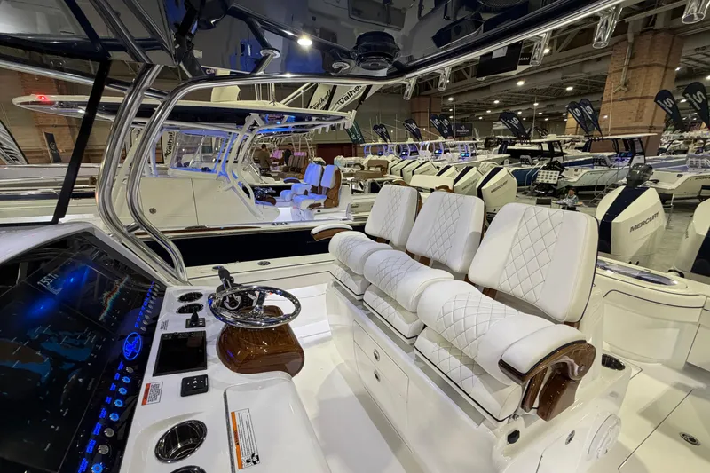 Slide: The Image of 2026 Valhalla Boatworks V-33 interior with luxurious seating and advanced dashboard controls. - 5