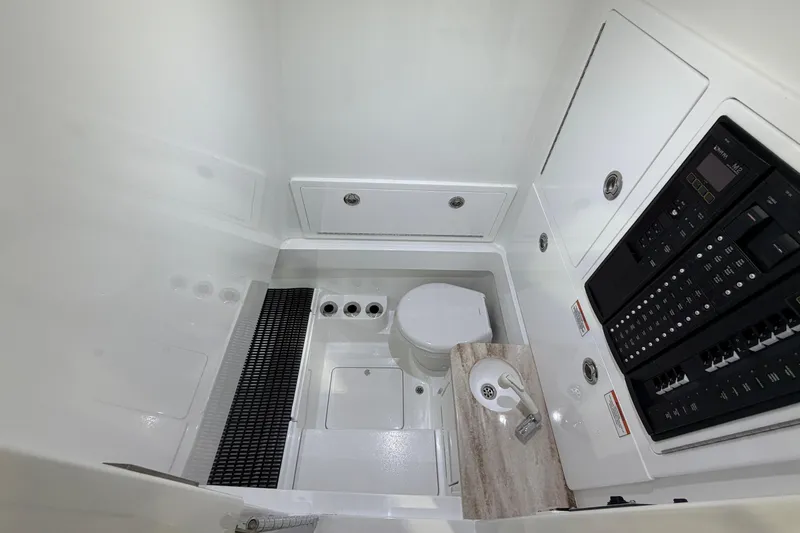 Slide: The Image of 2026 Valhalla Boatworks V-33 interior with toilet, sink, and control panel. - 7