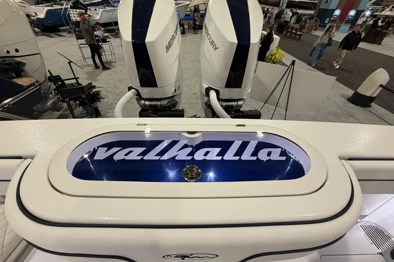 Slide: The Image of 2026 Valhalla Boatworks V-33 with Mercury engines at a boat show display. - 8