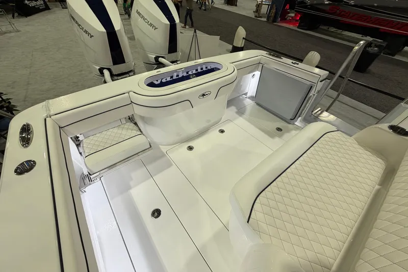 Slide: The Image of 2026 Valhalla Boatworks V-33 interior with white seating and dual Mercury engines. - 9