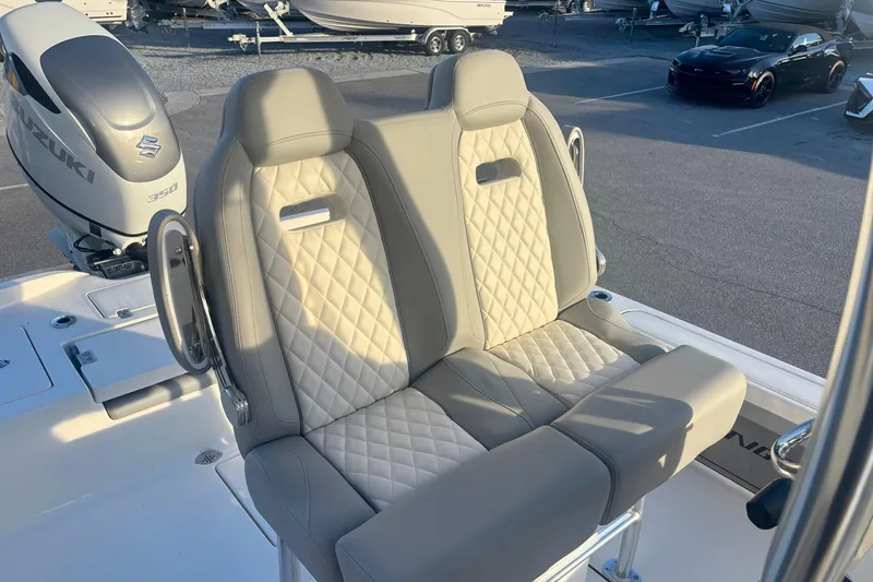 Slide: The Image of Luxury seating on 2026 Avenger AV26 boat with Suzuki 350 engine in marina. - 12