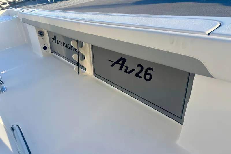 Slide: The Image of Avenger AV26 boat interior, 2026 model, featuring sleek design and branding. - 13
