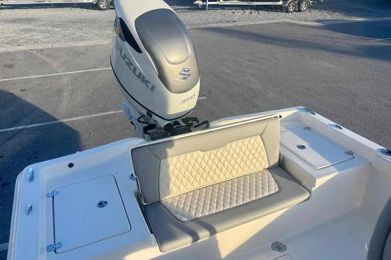 Slide: The Image of 2026 Avenger AV26 boat with Suzuki 350 engine and cushioned seating. - 16