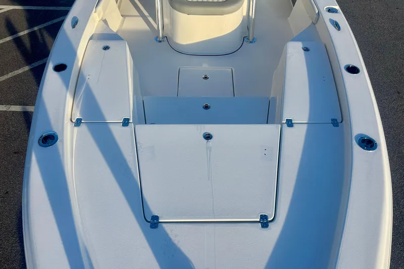 Slide: The Image of 2026 Avenger AV26 boat deck with storage compartments and rod holders. - 18