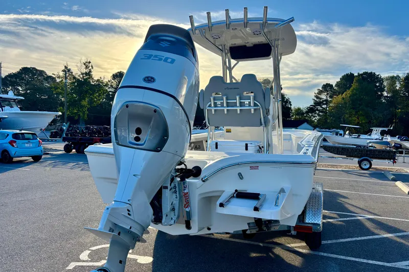 Slide: The Image of 2026 Avenger AV26 boat with powerful 350 engine, parked outdoors. - 6