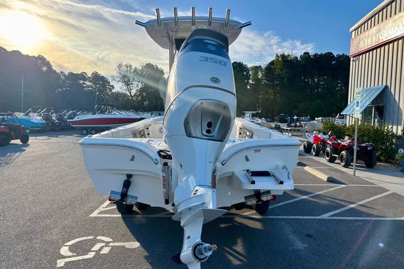 Slide: The Image of 2026 Avenger AV26 boat displayed outdoors with a powerful engine, under a clear sky. - 8