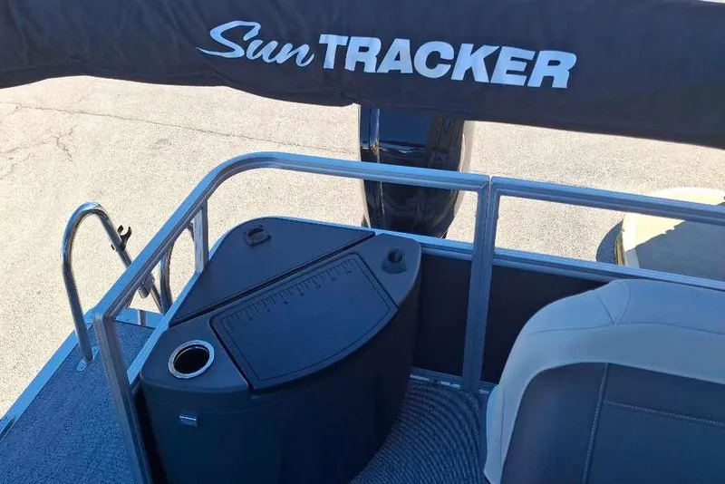 Slide: The Image of 2026 Sun Tracker Bass Buggy 18 DLX pontoon boat interior with seating and storage. - 33