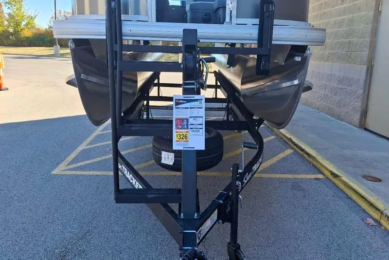 Slide: The Image of 2026 Sun Tracker Bass Buggy 18 DLX on trailer in parking lot. - 35