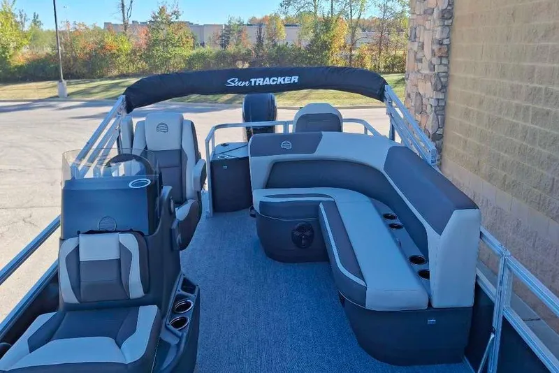 Slide: The Image of 2026 Sun Tracker Bass Buggy 18 DLX pontoon boat with spacious seating and modern design. - 36