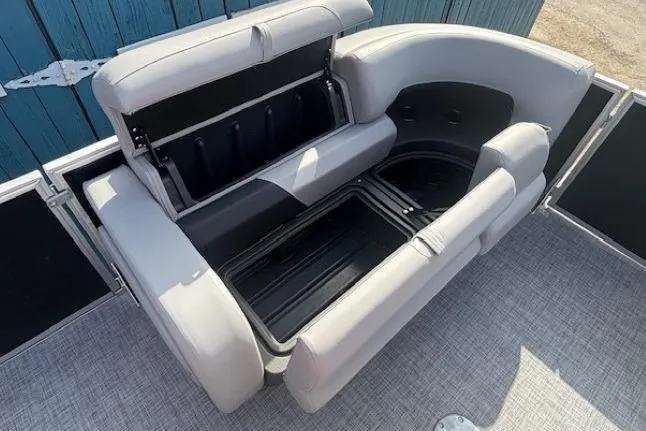 Slide: The Image of Open storage compartment on Sun Tracker Party Barge 22 RF DLX pontoon boat, 2026 model. - 11