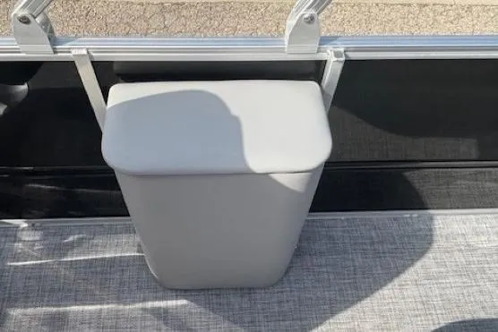 Slide: The Image of Sun Tracker Party Barge 22 RF DLX 2026, interior seating detail, gray upholstery. - 21