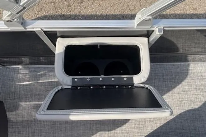 Slide: The Image of Open storage compartment on 2026 Sun Tracker Party Barge 22 RF DLX pontoon boat. - 22