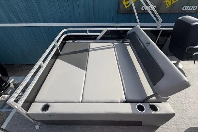 Slide: The Image of 2026 Sun Tracker Party Barge 22 RF DLX with spacious seating and cup holders. - 25