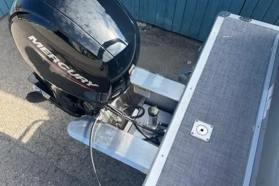 Slide: The Image of 2026 Sun Tracker Party Barge 22 RF DLX with Mercury outboard motor, docked. - 30