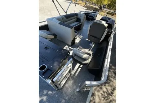 Slide: The Image of 2026 Sun Tracker Fishin' Barge 22 DLX interior with seating and fishing amenities. - 7