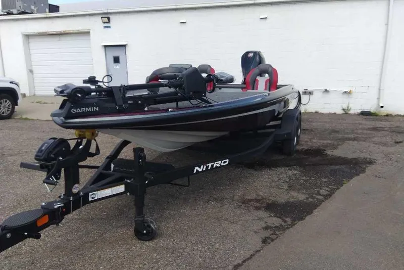 Slide: The Image of 2026 Nitro Z20 XL Pro fishing boat on trailer, parked outdoors. - 1