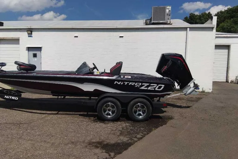 Slide: The Image of 2026 Nitro Z20 XL Pro boat on trailer, parked outside a white building. - 3