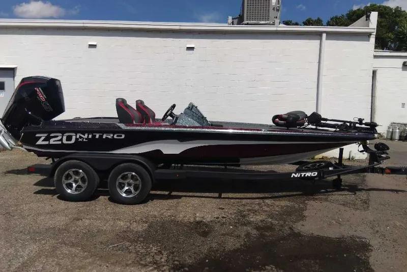 Slide: The Image of 2026 Nitro Z20 XL Pro boat on trailer, parked outdoors. - 5