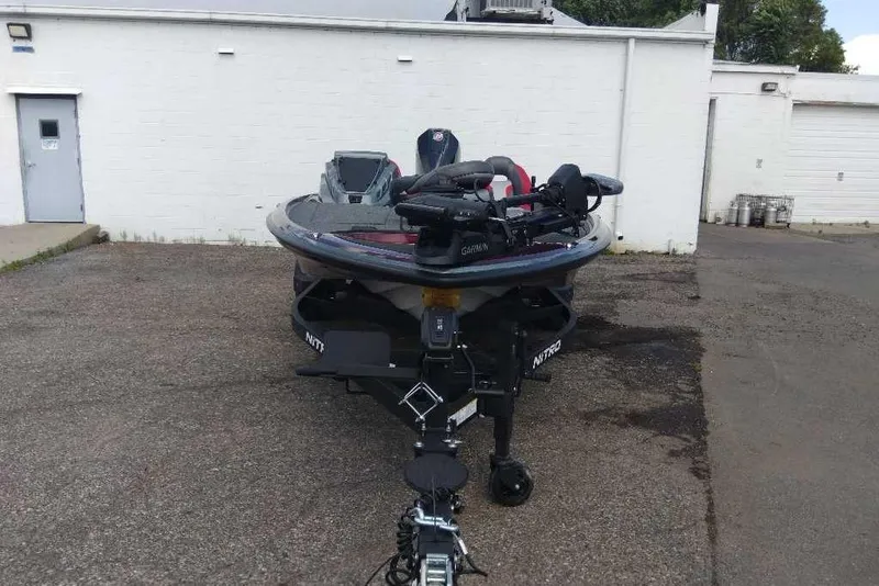 Slide: The Image of 2026 Nitro Z20 XL Pro boat parked in an industrial area. - 6