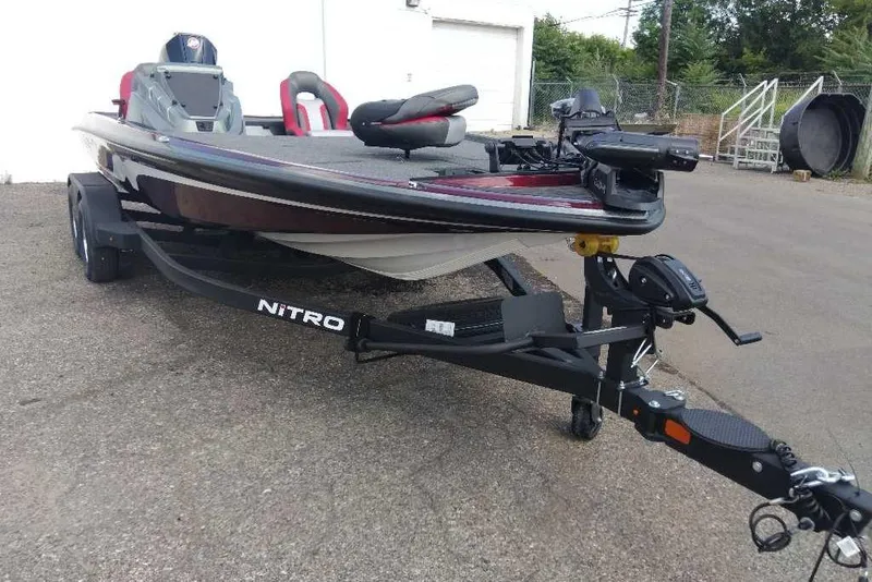 Slide: The Image of 2026 Nitro Z20 XL Pro fishing boat on trailer, parked outdoors. - 4