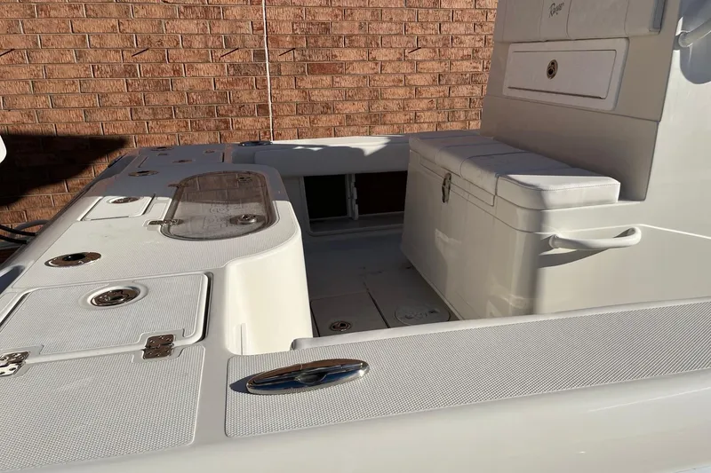 Slide: The Image of 2024 Ranger 2600 Bay boat interior with seating and storage compartments. - 4