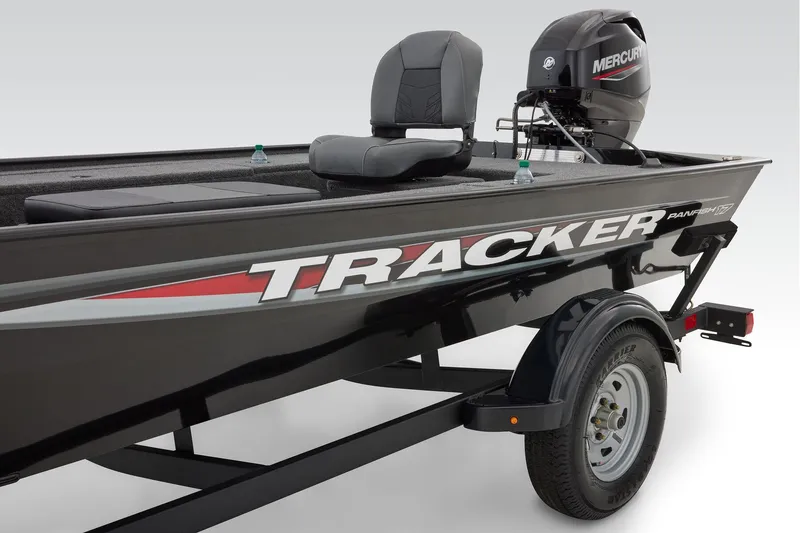 Slide: The Image of 2026 Tracker Panfish 17 boat on trailer in storage facility parking lot. - 7