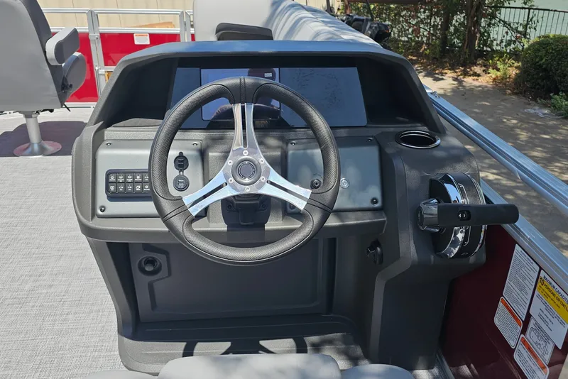 Slide: The Image of 2026 Sun Tracker SportFish 20 DLX steering console with modern controls and sleek design. - 79