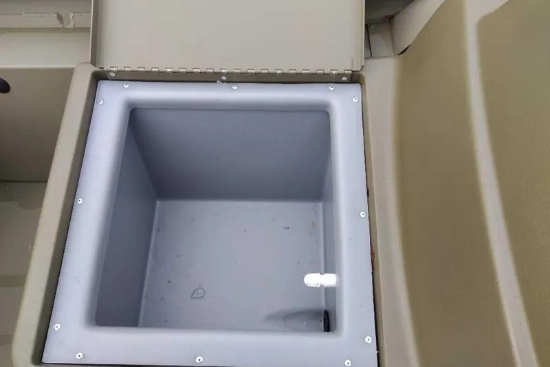 Slide: The Image of Open storage compartment in 2026 Tracker Grizzly 1754 SC boat. - 36