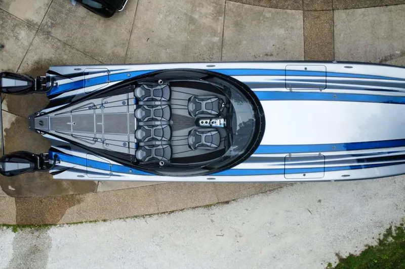 Slide: The Image of Overhead view of 2019 MTI 340X speedboat with sleek blue and white design. - 3