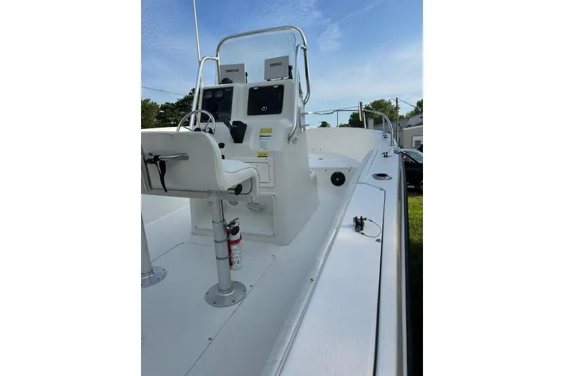 Slide: The Image of 2002 Seaswirl Striper 2101 Center Console boat with steering wheel and controls. - 7