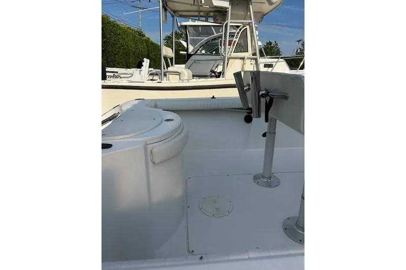 Slide: The Image of 2002 Seaswirl Striper 2101 Center Console boat interior, featuring seating and console area. - 8