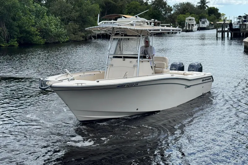 The Image of 2015 Grady-White Fisherman 257 boat cruising on a calm river. - 1