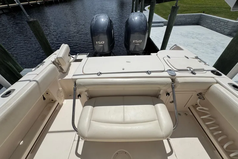 Slide: The Image of 2015 Grady-White Fisherman 257 boat with dual 150 Yamaha engines at dock. - 12