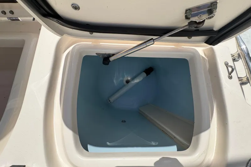 Slide: The Image of Livewell compartment in a 2015 Grady-White Fisherman 257 boat, open lid view. - 14