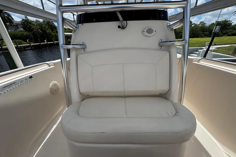 Slide: The Image of 2015 Grady-White Fisherman 257 boat seat with stainless steel frame, dockside view. - 16