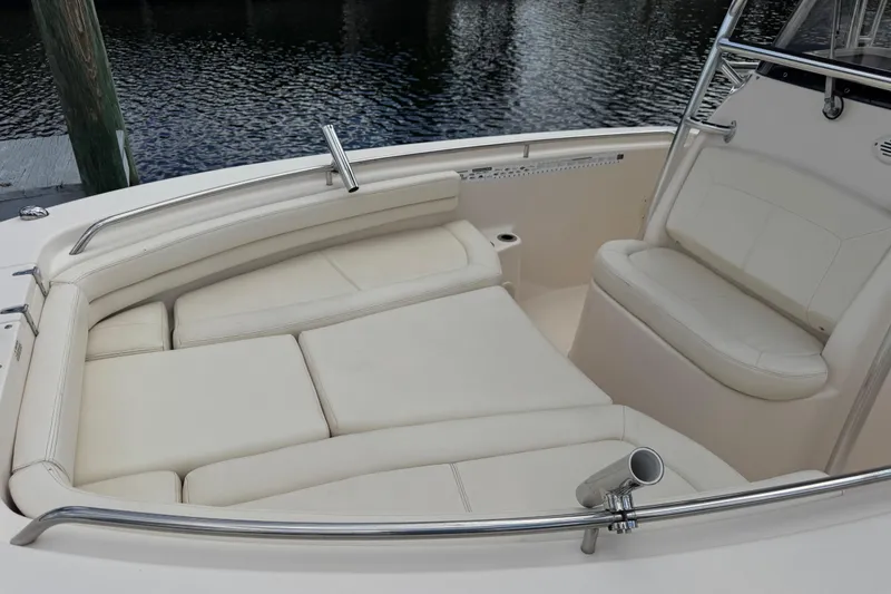 Slide: The Image of 2015 Grady-White Fisherman 257 boat interior with cushioned seating and stainless steel railings. - 17
