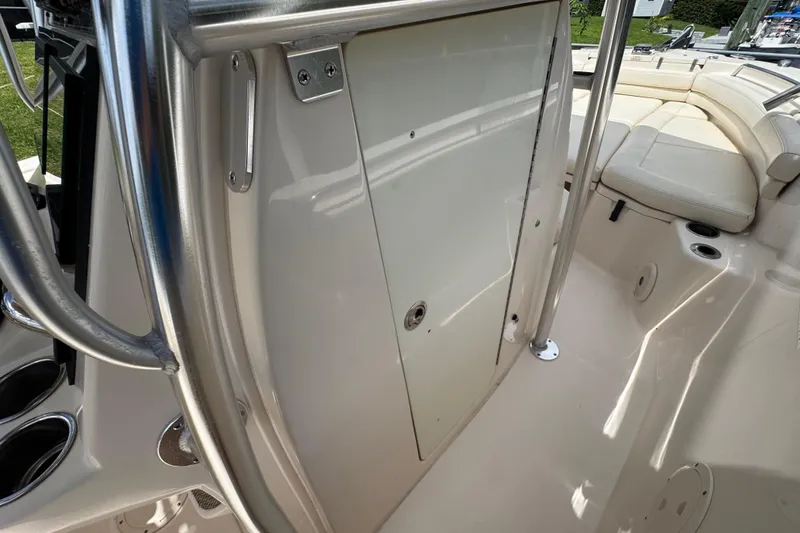 Slide: The Image of 2015 Grady-White Fisherman 257 interior, featuring seating and stainless steel railings. - 24