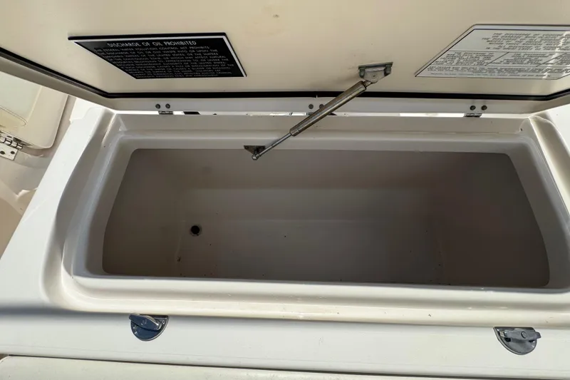 Slide: The Image of Open storage compartment on 2015 Grady-White Fisherman 257 boat. - 29