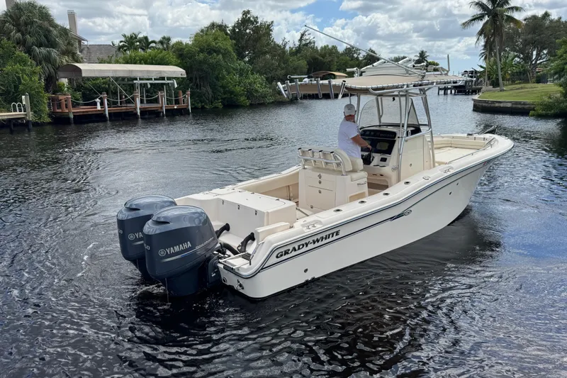 Slide: The Image of 2015 Grady-White Fisherman 257 boat with dual Yamaha engines on a scenic waterway. - 6