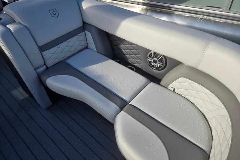 Slide: The Image of Luxurious seating on 2026 Godfrey Monaco 235 ULC boat with elegant upholstery and speaker. - 10