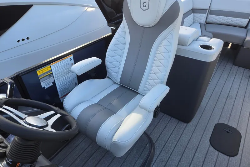 Slide: The Image of Captain's chair on 2026 Godfrey Monaco 235 ULC pontoon boat, featuring sleek design and comfort. - 13