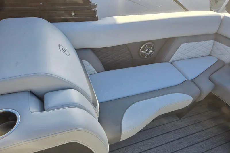 Slide: The Image of Luxurious seating on 2026 Godfrey Monaco 235 ULC boat, featuring elegant upholstery and integrated speaker. - 23