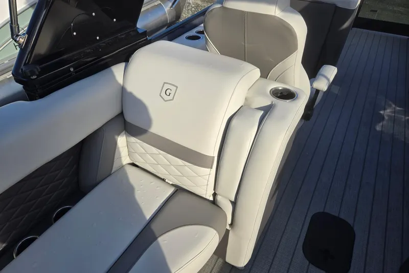 Slide: The Image of Luxurious seating on 2026 Godfrey Monaco 235 ULC boat with cup holders and elegant design. - 31