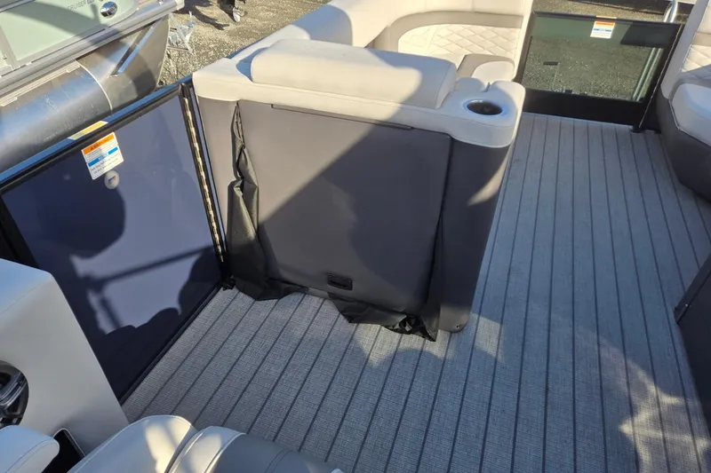 Slide: The Image of 2026 Godfrey Monaco 235 ULC boat interior with cushioned seating and cup holder. - 35