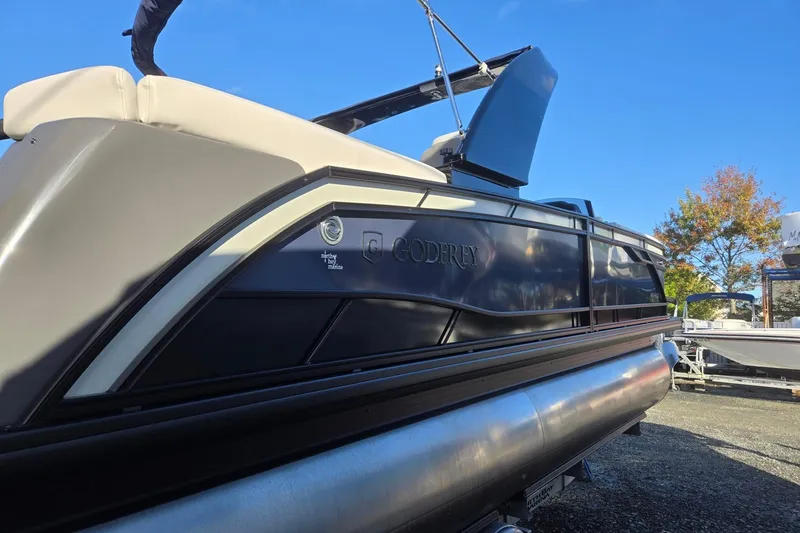 Slide: The Image of 2026 Godfrey Monaco 235 ULC pontoon boat with sleek design and modern features. - 6